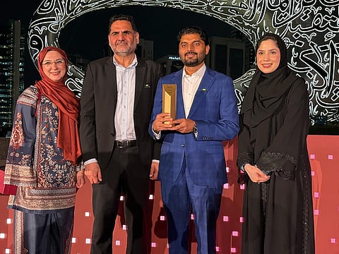 Mariam Mumtaz, Khalid Imtiaz and Zahid Hussain after receiving CDA's Ethraa Award in Gold category in Dubai