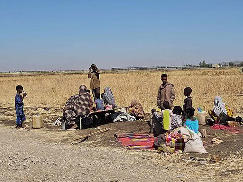 Displaced Sudanese react after spending a night in Gedaref city eastern Sudan on December 26, 2025.