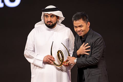 Sheikh Ahmed Bin Mohammed Bin Rashid Al Maktoum, Second Deputy Ruler of Dubai and Chairman of the Dubai Media Council presenting the award to legendary Filipino boxer Manny Pacquiao on the opening day of World Sports Summit in Dubai on Monday.