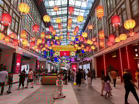 Tourists in Dubai Mall Chinatown.