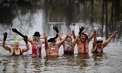 Members of the "Berliner Seehunde" (Berlin Seals) winter swimming club attend the club's traditional New Year swimming event at Lake Oranke in Berlin.