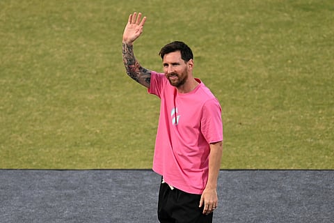 Argentinia's soccer star Lionel Messi waves to fans during his India tour in New Delhi, India, Monday, Dec. 15, 2025. (AP Photo)