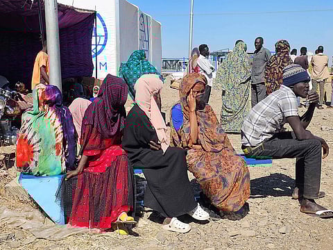 Sudanese displaced from the Heglig area in western Sudan wait to receive humanitarian aid at the Abu Al Naga displacement Camp in the in Gedaref State, some 420km east of the capital Khartoum on December 30, 2025.