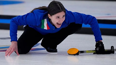FILE -Italy's Stefania Constantini, directs her team mate, during the mixed doubles curling match against Sweden, at the 2022 Winter Olympics, Feb. 6, 2022, in Beijing. (AP Photo/Nariman El-Mofty, File)