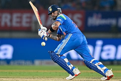 India's Virat Kohli plays a shot during the first one-day international (ODI) cricket match between India and New Zealand at the Kotambi Stadium in Vadodara on January 11, 2026.