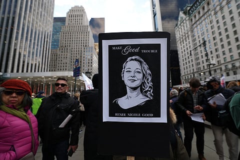 A person holds a poster of Renee Nicole Good who was shot and killed by a US Immigration and Customs Enforcement (ICE) agent in Minneapolis, Minnesota during a protest organised by Rise and Resist against US Immigration and Customs Enforcement (ICE) activities and the US intervention in Venezuela in New York on January 11, 2026.