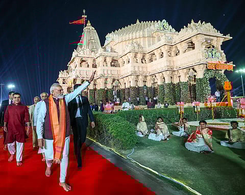 Prime Minister Narendra Modi waves as he arrives at Somnath Temple, in Gir Somnath.