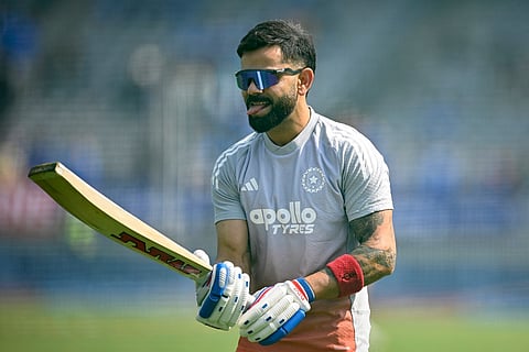 India's Virat Kohli gestures as he warms up before the start of the first one-day international (ODI) cricket match between India and New Zealand at the Kotambi Stadium in Vadodara on January 11, 2026.