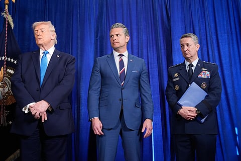 President Donald Trump, Defense Secretary Pete Hegseth and Chairman of the Joint Chiefs of Staff Gen. Dan Caine listen as Secretary of State Marco Rubio speaks during a news conference at Mar-a-Lago, Saturday, Jan. 3, 2026, in Palm Beach, Fla. (AP Photo/Alex Brandon)