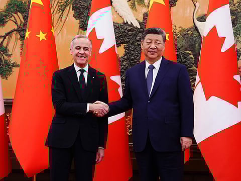 Canada's Prime Minister Mark Carney, left, meets with Chinese President Xi Jinping at the Great Hall of the People in Beijing Friday, Jan. 16, 2026.