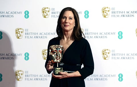 FILE - Kathleen Kennedy, winner of the BAFTA Fellowship, poses with her award backstage at the BAFTA Film Awards in central London, Feb. 2, 2020. (Photo by Joel C Ryan/Invision/AP, File)