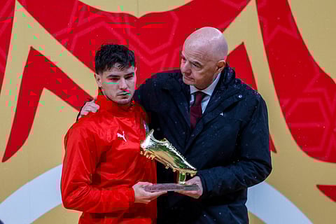 Morocco's forward #10 Brahim Diaz receives the Golden Boot from FIFA President Gianni Infantino during presentation ceremony at the end of the Africa Cup of Nations (CAN) final football match between Senegal and Morocco at the Prince Moulay Abdellah Stadium in Rabat on January 18, 2026.
