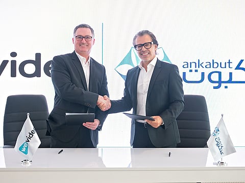 (L-R) Kevin Knight, Chief Executive Officer of WeVideo and Tarek Jundi, Chief Executive Officer of Ankabut shake hands after signing the partnership deal.