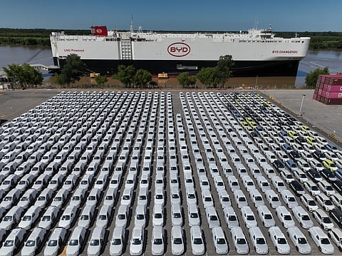 The BYD Changzhou car carrier is docked at Terminal Zarate in the Buenos Aires province of Argentina, Tuesday, Jan. 20, 2026, where hybrid and electric vehicles shipped from China are parked next to the ship. (AP Photo/Victor R. Caivano)