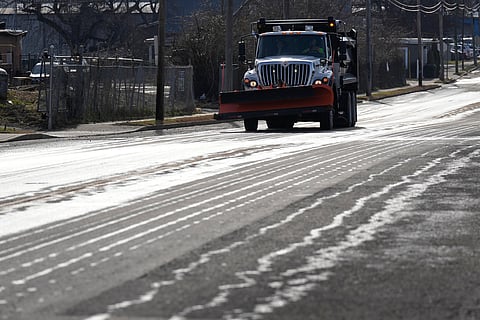 A Nashville Department of Transportation truck applies salt brine to a roadway Thursday, Jan. 22, 2026, in Nashville, Tenn. ahead of a winter storm expected to hit the state over the weekend.