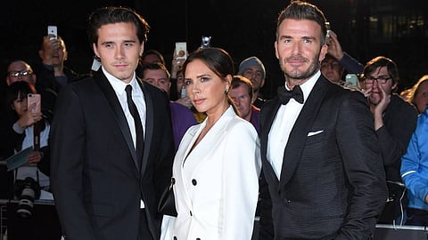 Cruz Beckham with Victoria Beckham and David Beckham