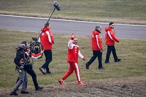 Ferrari's British driver Lewis Hamilton waves to fans after testing the new Formula 1 Ferrari SF-26 at Fiorano Circuit in Fiorano Modenese on January 23, 2026.