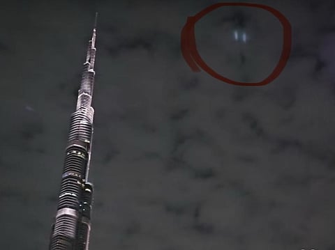 A screengrab from an Instagram video shows the mysterious green lights illuminating the sky near Burj Khalifa.