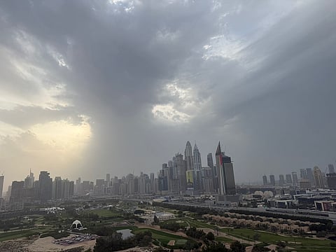 Rain clouds hover above the Dubai skyline on Sunday afternoon.