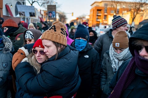People pay their respects at a memorial site for Alex Pretti on January 25, 2026 in Minneapolis, Minnesota.