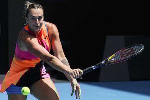 Belarus' Aryna Sabalenka hits a return against Canada's Victoria Mboko.