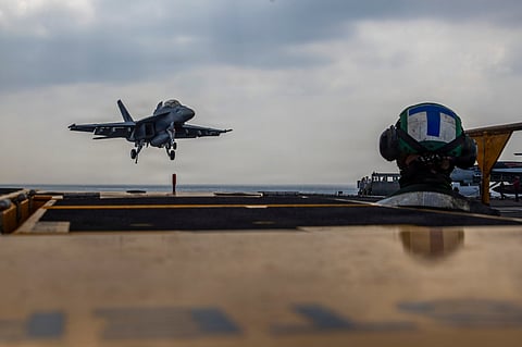 A Boeing F/A-18E Super Hornet landing on the Nimitz-class aircraft carrier USS Abraham Lincoln in the Indian Ocean on January 22, 2026.