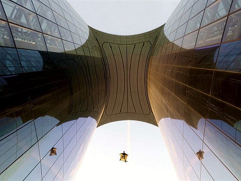 Wingsuit pilot Nicholas Scalabrino flies through Ciel Dubai Marina with his reflections seen on both sides of the glass-clad façade.
