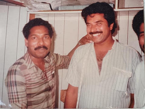 From 1987: Actor Mammootty smiles as Keralite tailor KN Mohanan takes his measurements in a small Al Qusais shop.