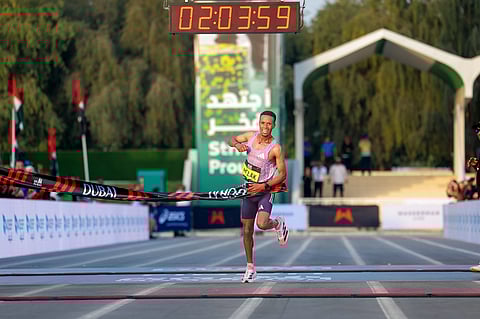 Nibret Melak from Ethiopia wins the 25th anniversary edition of the Dubai marathon.