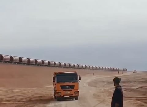 A view of Algeria's desert railway, financed by the Algerian state and partly built by a Chinese consortium. It transports iron ore from a giant mine in the Gara Djebilet deposit in the south to the city of Bechar located 950 km north, to be taken to a steel production plant near Oran further north.