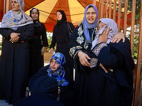 Mourners weep during the funeral of Palestinians, who were reportedly killed by an Israeli air strike, in Khan Yunis, southern Gaza Strip on January 31, 2026.