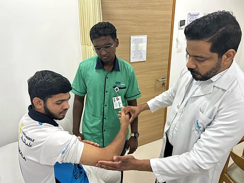 Mohammed Saifuddin being examined by Dr Shafeed Thadathil Parambil during a follow-up visit at Aster Cedars Hospital & Clinic, Jebel Ali.