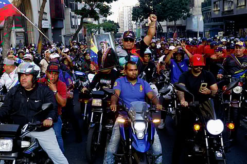 Government supporters march one month after the ouster of Venezuelan President Nicolas Maduro and First Lady Cilia Flores in Caracas on February 3, 2026.
