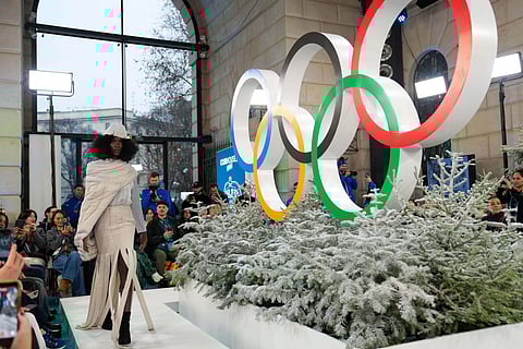 A model presents an outfit designed by students from Milan's Academia di Brera during the Olympic Games Winter Fashion Showcase as part of the Milano Cortina 2026 Winter Olympic Games in Milan on February 4, 2026.