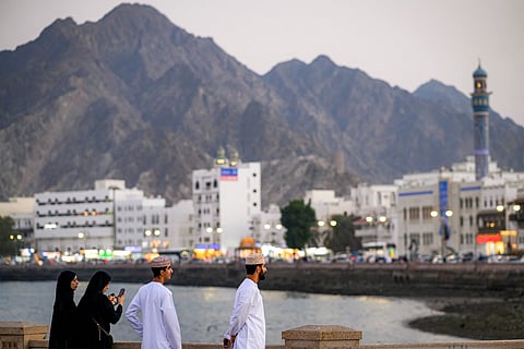 People stand along the corniche at Sultan Qaboos port in Oman's capital Muscat on February 5, 2026.