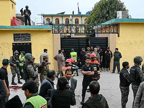Security personnel stand guard outside a mosque following an explosion, in Islamabad on February 6, 2026.