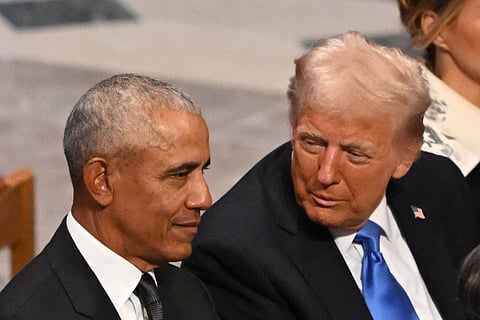 US President-elect Donald Trump speaks with former President Barack Obama as they attend the State Funeral Service for former US President Jimmy Carter at the Washington National Cathedral in Washington, DC, on January 9, 2025.