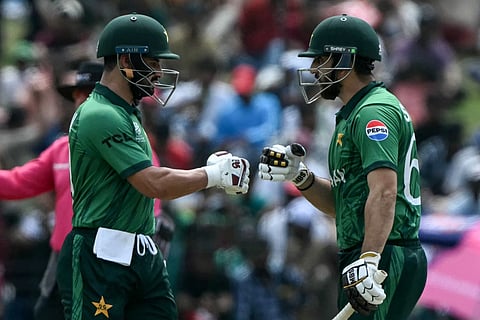 Pakistan's captain Salman Agha (R) and Sahibzada Farhan bump their fists during the 2026 ICC Men's T20 Cricket World Cup group stage match between Pakistan and Netherlands at the Sinhalese Sports Club (SSC) Ground in Colombo on February 7, 2026.