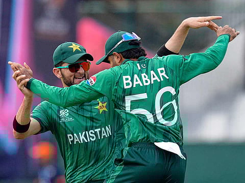 Pakistan's Babar Azam, right, and teammate Shaheen Shah Afridi celebrate after taking a co-ordinated catch to dismiss Netherlands' Michael Levitt during the T20 World Cup cricket match in Colombo, Sri Lanka, Saturday, February 7, 2026.
