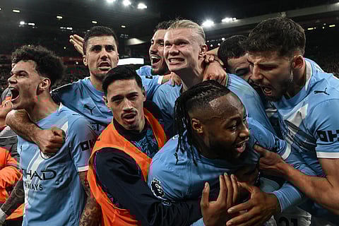 Manchester City's Norwegian striker #09 Erling Haaland (C) celebrates with teammates after scoring his team's second goal during the English Premier League football match between Liverpool and Manchester City at Anfield in Liverpool, north west England on February 8, 2026.