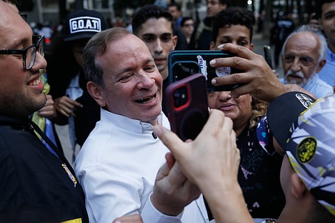 Opposition leader Juan Pablo Guanipa records a video message to supporters after his release from prison in Caracas, Venezuela, Sunday, Feb. 8, 2026.