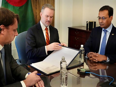 US Trade Representative Jamieson Greer and Banglasdesh officials sign the agreement