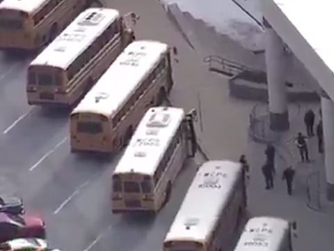 A drone shot shows officers dispatched to Thomas S. Wootton High School in Rockville, a suburb of Washington, DC. The suspect was identified and arrested near the school shortly after, the department said.