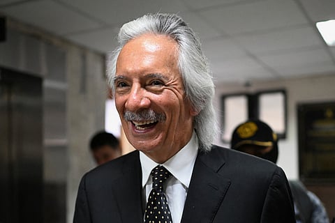 Guatemalan journalist and founder of the former newspaper El Periodico, Jose Ruben Zamora, smiles as he leaves the Supreme Court of Justice after a hearing in Guatemala City on February 12, 2026.