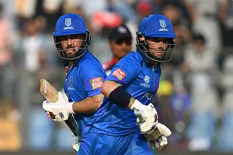 Italy's Justin Mosca (R) and Anthony Mosca run between the wickets during the 2026 ICC Men's T20 Cricket World Cup group stage match between Nepal and Italy at the Wankhede Stadium in Mumbai on February 12, 2026.