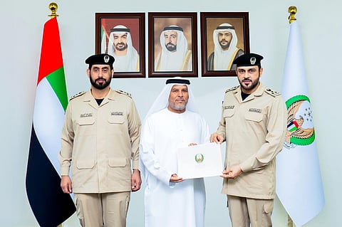 Salim Salem Al Ketbi (centre) was recognised for his decisive action after a vehicle caught fire.