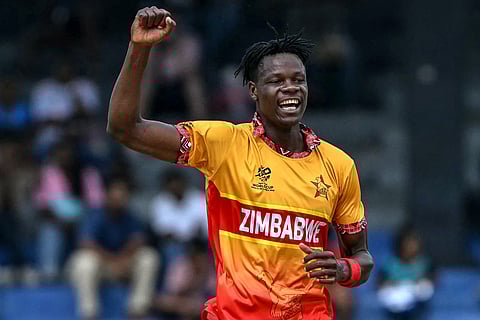 Zimbabwe's Blessing Muzarabani celebrates after taking the wicket of Australia's Adam Zampa during the 2026 ICC Men's T20 Cricket World Cup group stage match between Australia and Zimbabwe at the R Premadasa Stadium in Colombo on February 13, 2026.