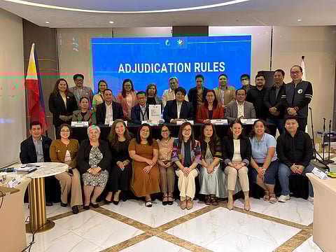 The signing of the "Rules of procedure for the adjudication of cases" by the department of migrant workers held in Quezon city, Philippines.