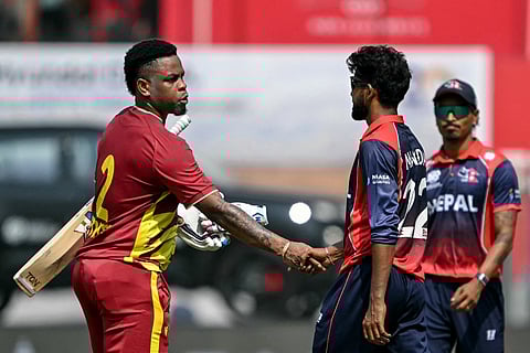 West Indies' Shimron Hetmyer (L) shakes hands with Nepal's Nandan Yadav at the end of the 2026 ICC Men's T20 Cricket World Cup group stage match between Nepal and West Indies at the Wankhede Stadium in Mumbai on February 15, 2026.