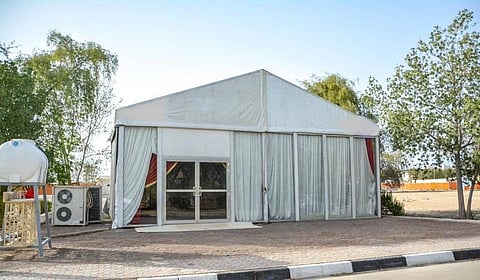 One tent per villa, no charcoal or sales; digital permit issued free via TAMM.